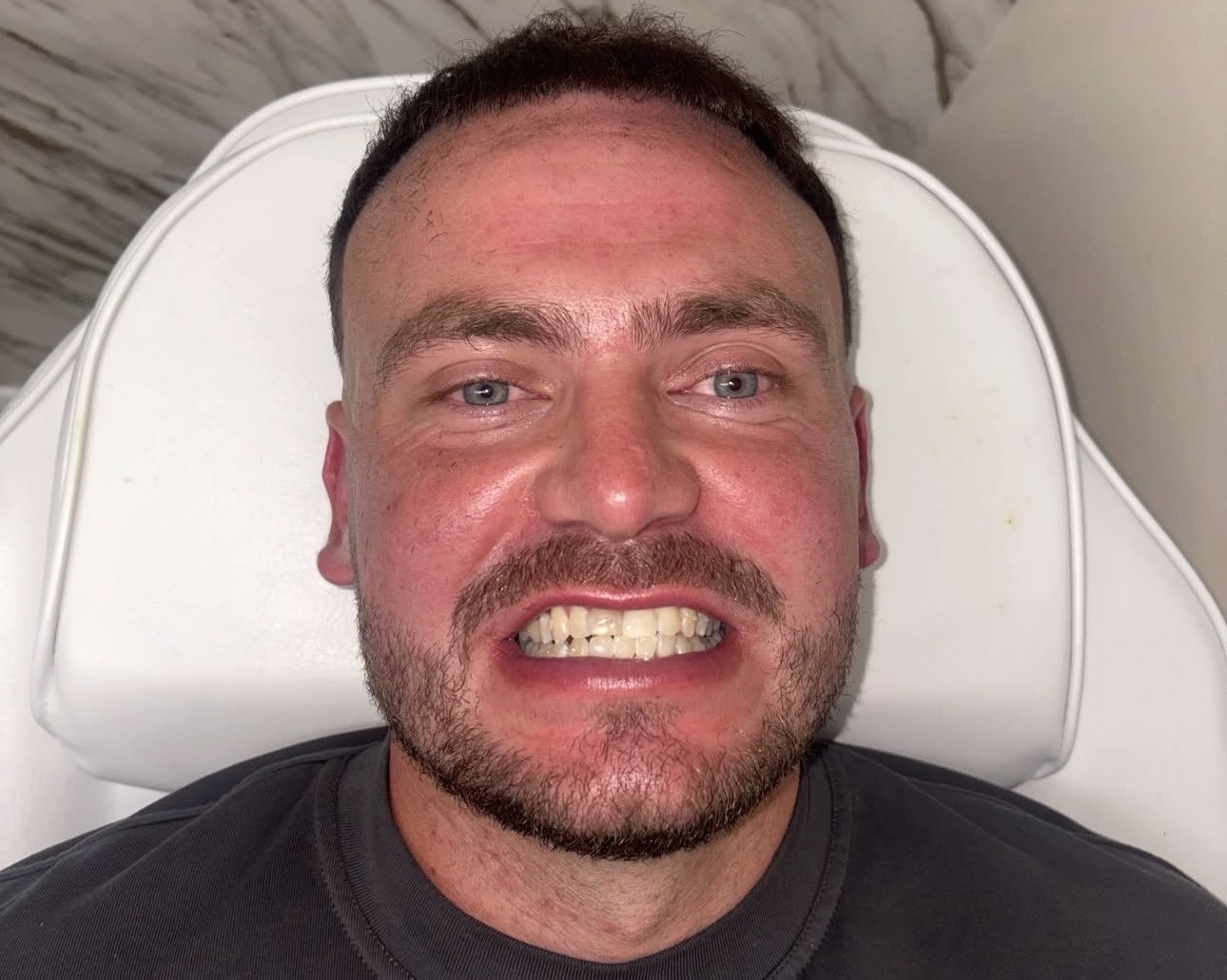 Shane Cole smiling at Glow Whitez Beauty Studio