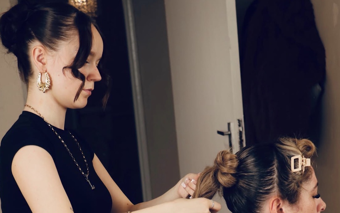 A client having their hair styled at Glow Whitez